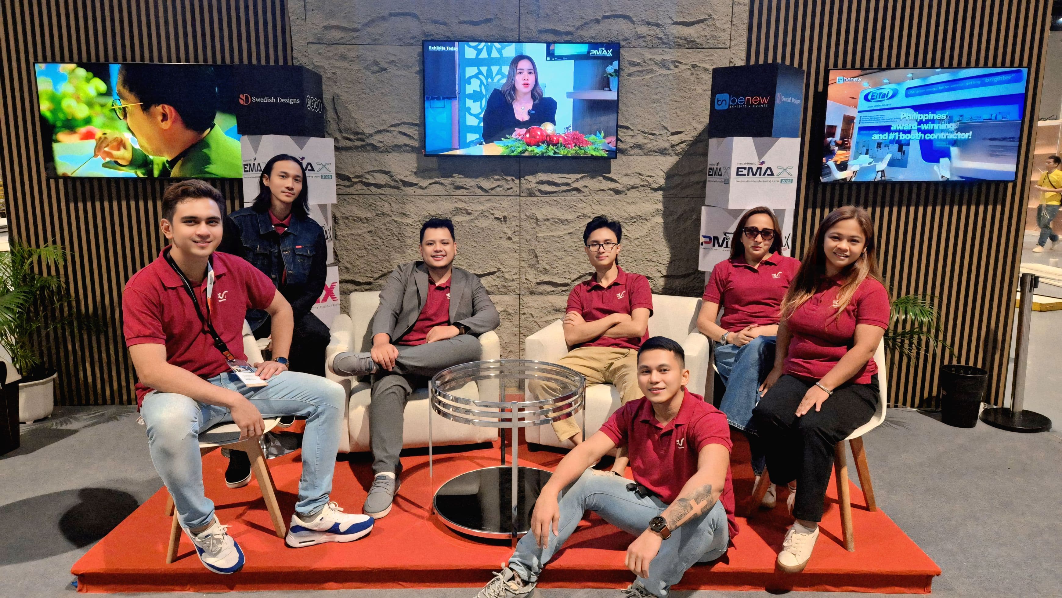 Full AHA Innovations booth team photo at Exhibits Today lounge with JC center