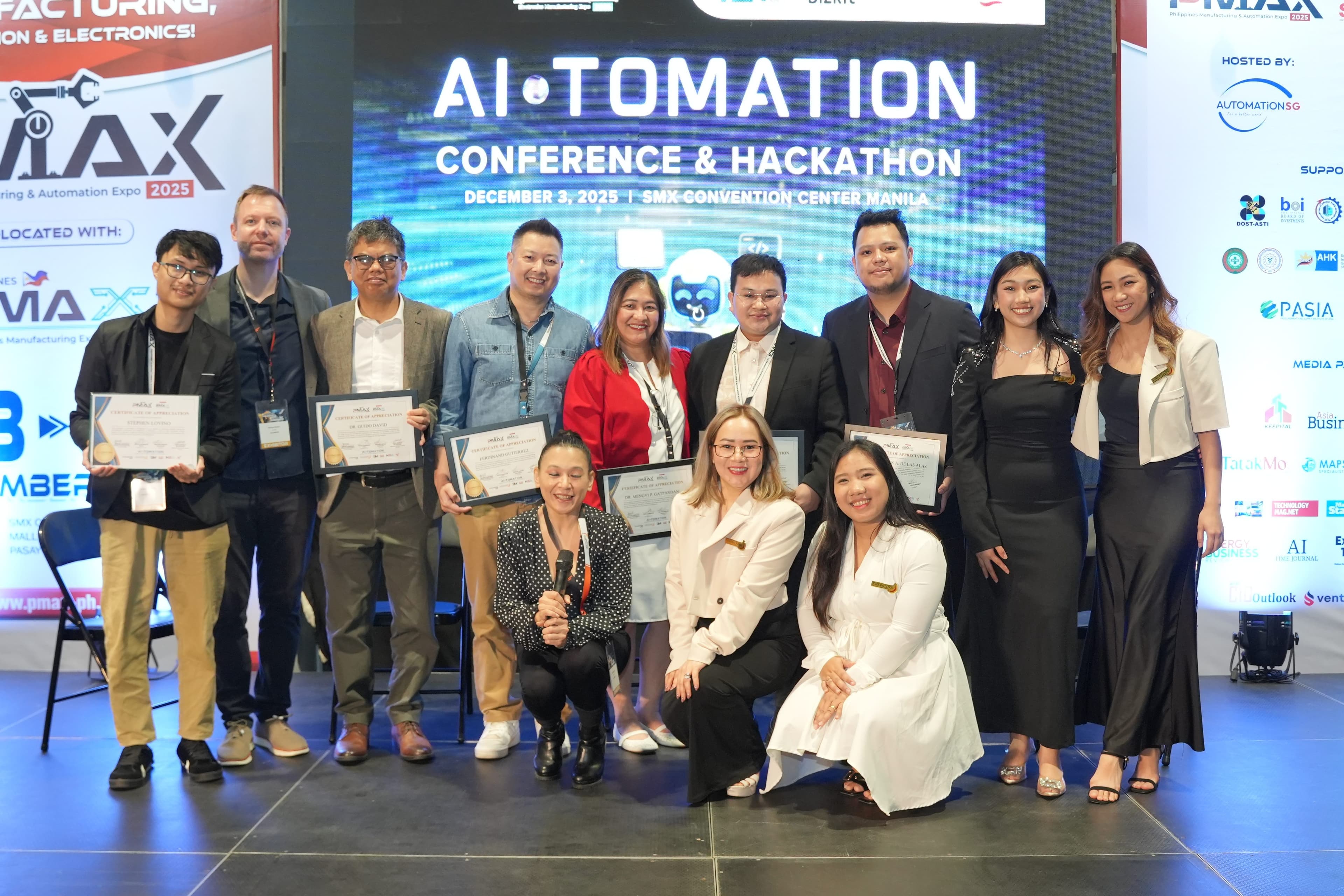 Group photo of AI-TOMATION Conference speakers and awardees in front of Thank You backdrop