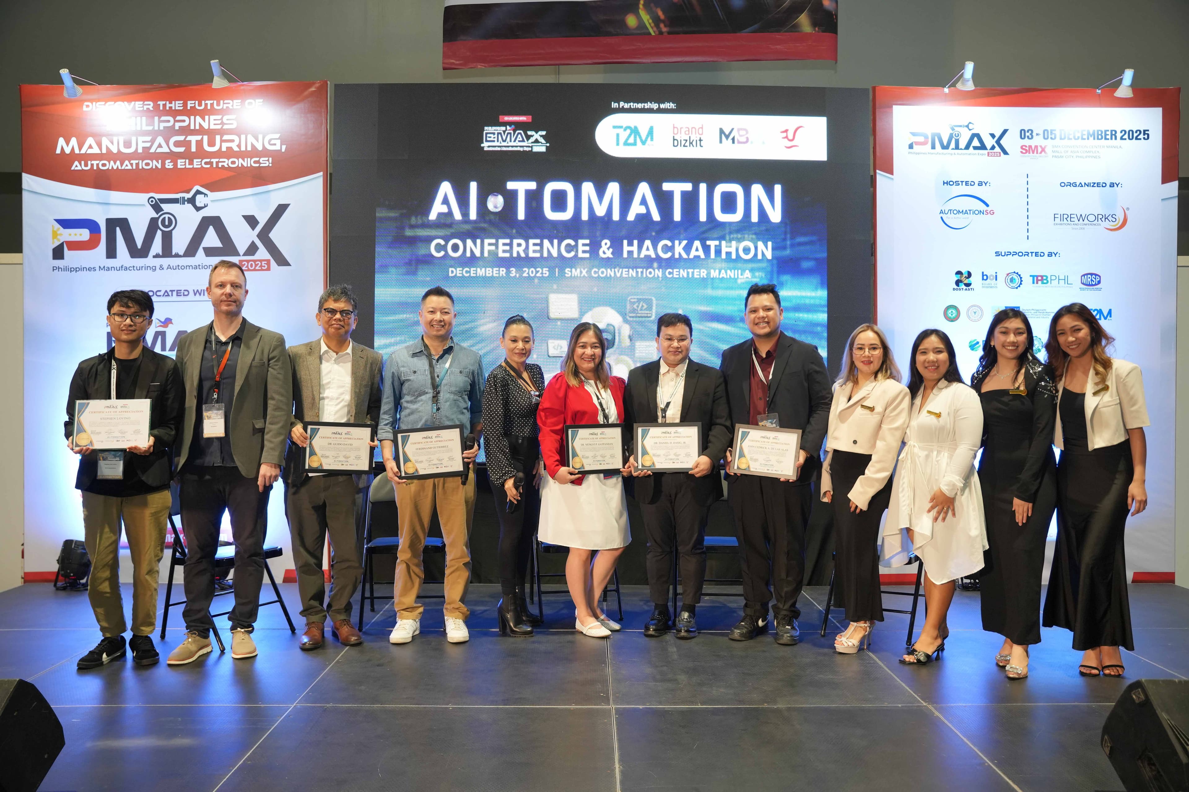 JC on stage receiving Certificate of Appreciation at AI-TOMATION Conference with conference organizers