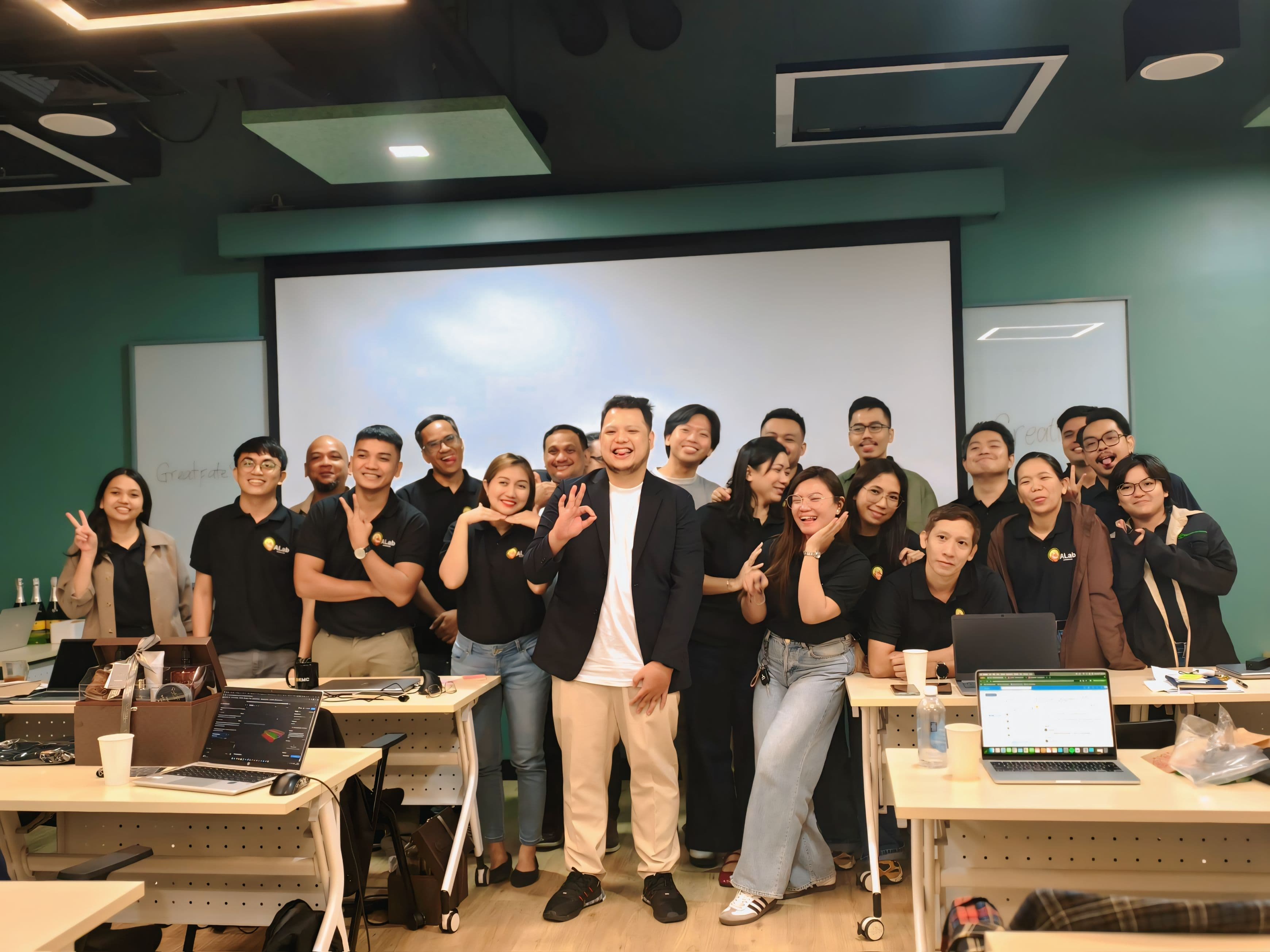 JC with Millennial Business Academy team after a corporate training session in modern office space