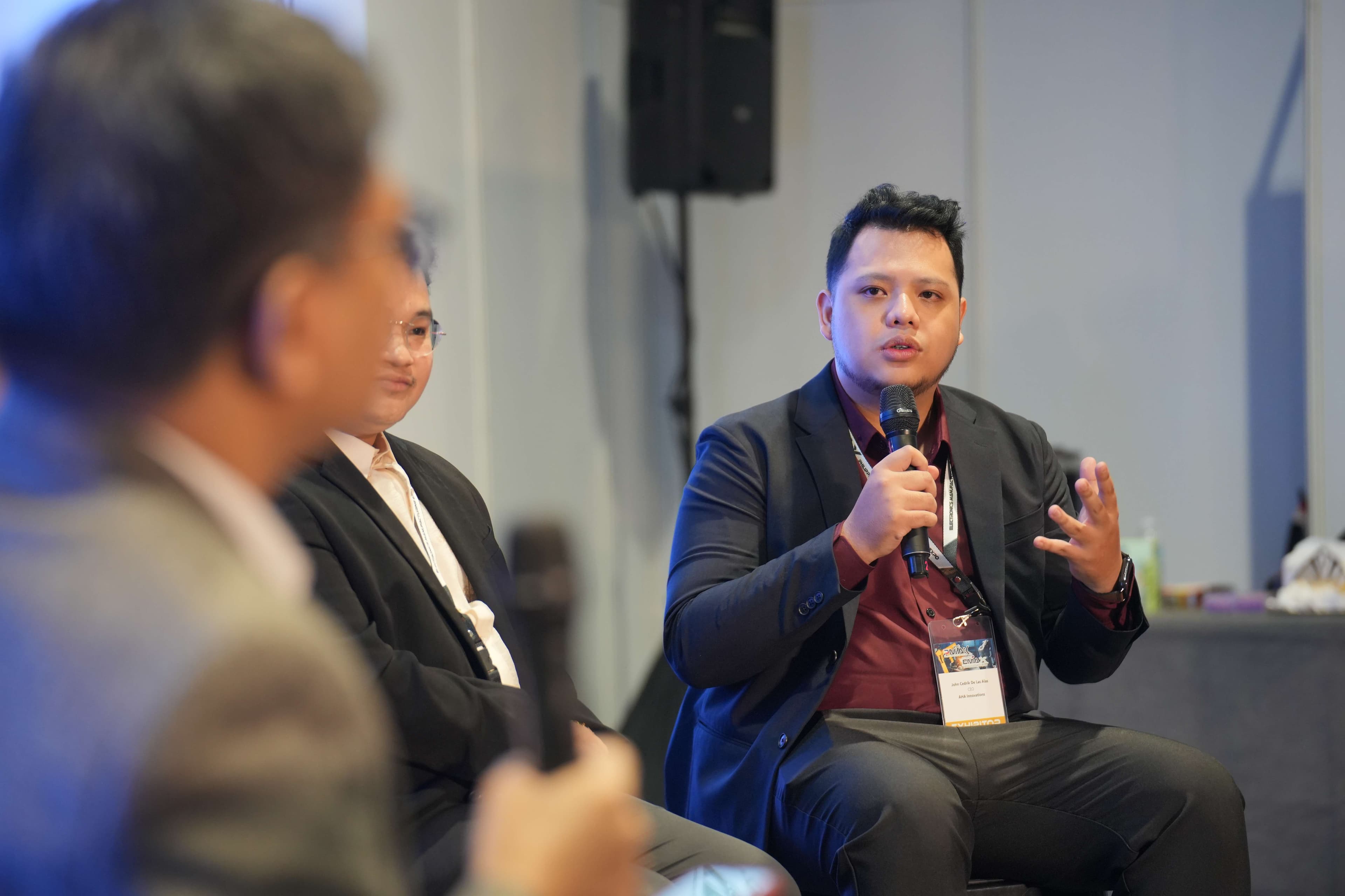 JC speaking on a fireside panel with moderator and fellow industry leaders