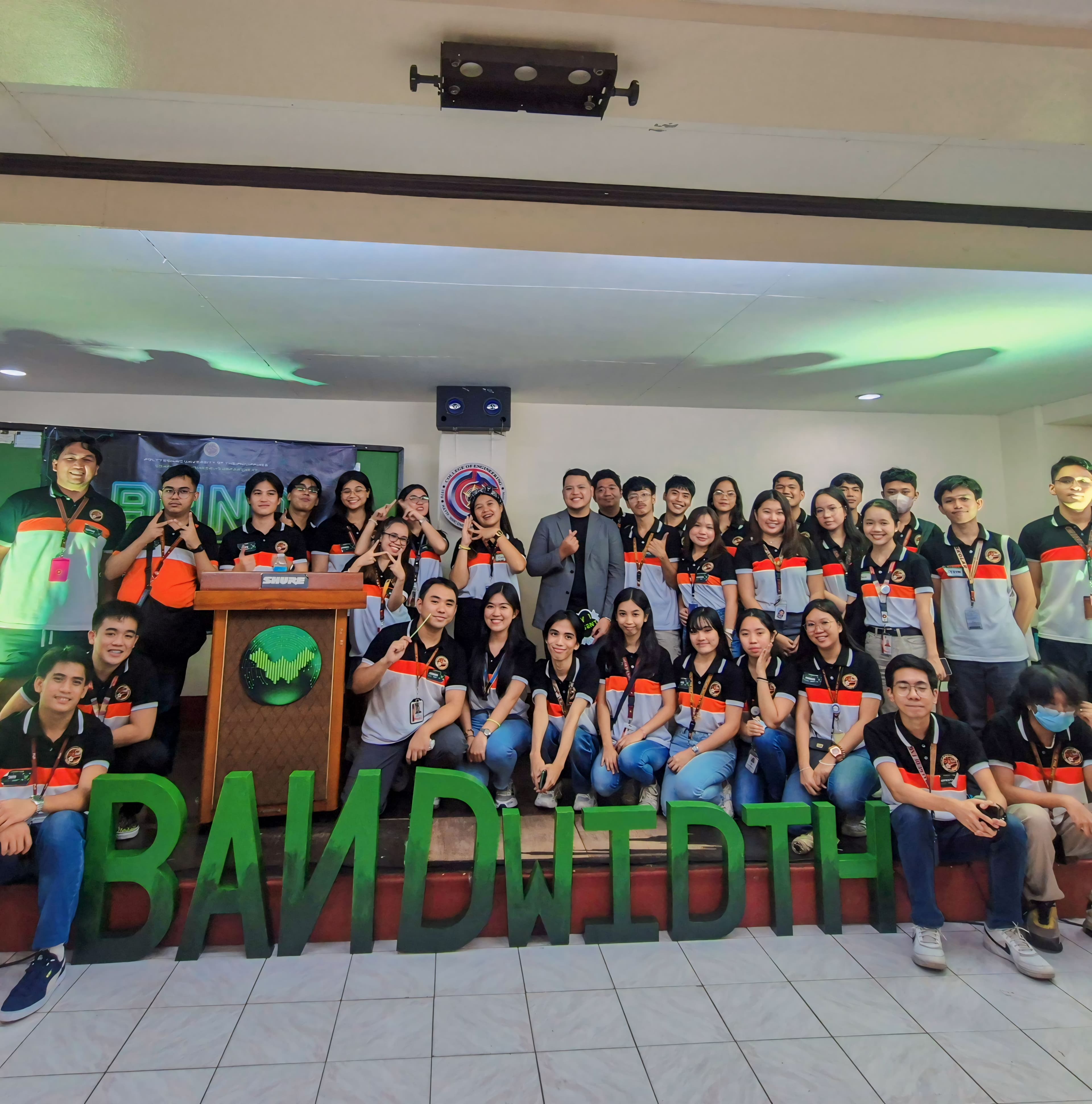 Large BAMDIT summit team photo with JC center, matching event shirts and 3D BAMDIT letters