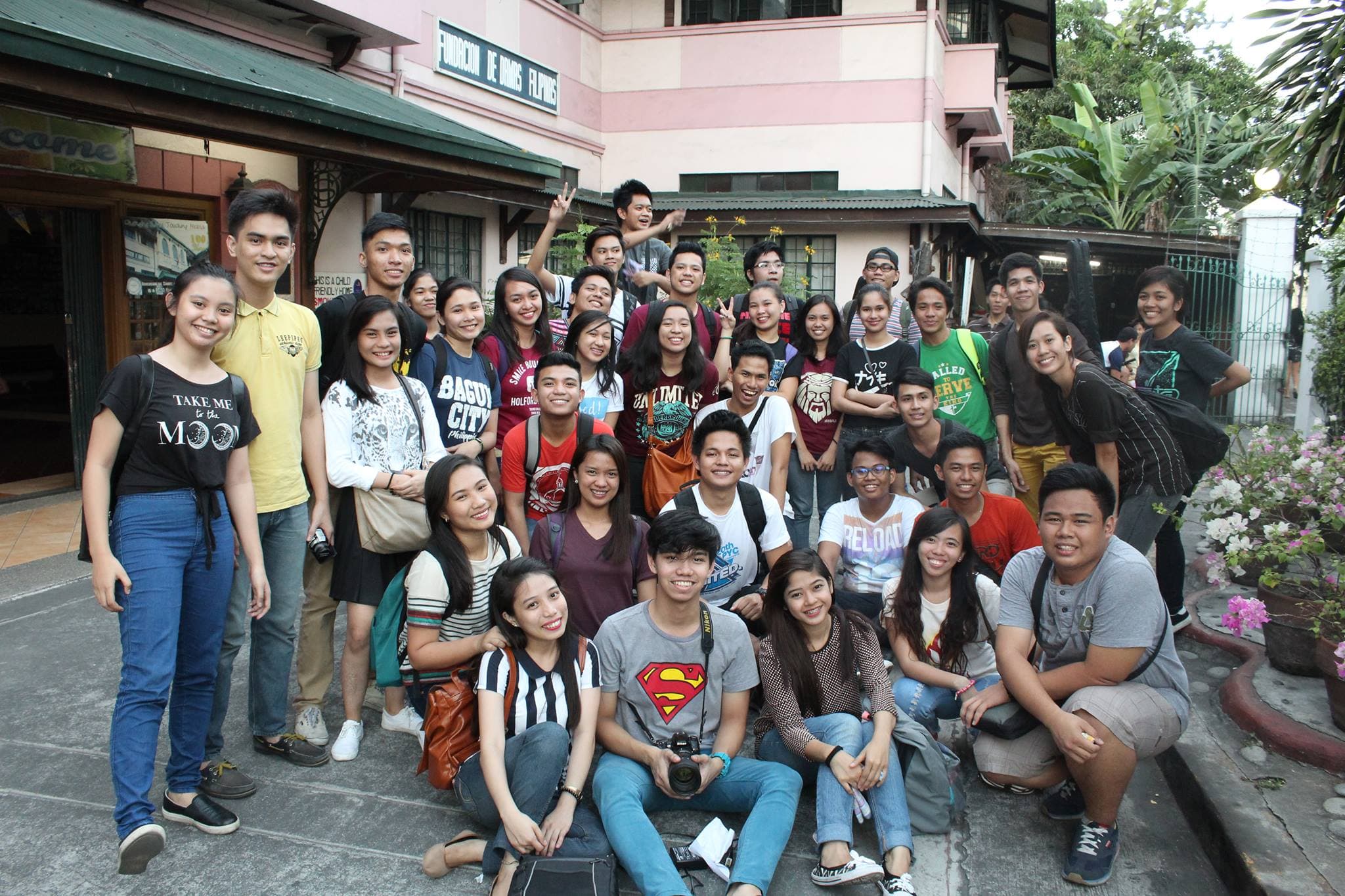 Youth for Christ team photo outside historic Baluarte de San Diego site in Manila